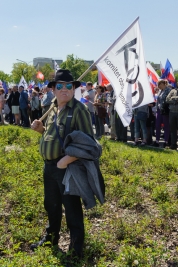 Protester-in-black-hat-and-glasses-with-KOD-flag-at-the-opposition-manifestation-We-and-will-be-in-