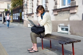 The-woman-with-hanger-and-laptop-sitting-at-the-bus-stop-after-the-manifestation-Save-Women-against-